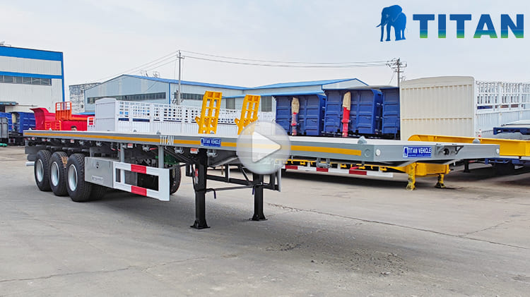 Video of Heavy Duty Flatbed Trailer  Heavy Duty Flatbed Trailer in Mali Price: 9700 USD The flatbed trailer is specifically designed for road transport of standard containers and is commonly used in ports, logistics centers, and similar settings. Due to the versatility, ease of loading and unloading, and cost-effective operation, the heavy duty flatbed trailer for sale is widely utilized in modern logistics and transportation. Additionally, the 40 ft flat bed trailer is also suitable for carrying bulk cargo, making a flexible solution for various transport requirements.  Specification of Flat Bed Trailer Overall Dimension: 12500mm*2500mm*1590mm Load Capacity: 60 ton Floor Plate: 3mm thick pattern floor plate Side Beam: 160mm high Axles: 3 axles, 13ton Tire: 12 units, 12R22.5 Landing Gear: 28 ton Suspension: mechanical suspension Leaf Spring: 10 layers Lamp: LED Lamp with anti-theft design Bumper: 4mm thick   Advantage of Flatbed Trailer The flatbed trailer emphasizes the combination of practicality and durability during the design process, targeting to improve the performance of heavy duty flatbed trailer for sale and adapt to transportation tasks in different regions and working conditions.  In order to further enhance the firmness of the structure, the beam of the heavy duty flatbed trailer for sale adopts automatic submerged arc welding technology to make the connection parts tighter, effectively ensuring the integrity and bearing capacity of the frame structure. In terms of painting, the flatbed trailer is treated with powder spray paint. Although the process is higher than the traditional painting method in manufacturing cost, the performs better in anti-aging, anti-corrosion and weather resistance.  Powder spray paint can keep the surface of bright and effectively avoid fading problems in areas like Mali , and improve the retention of the appearance. The painting method is not easy to fall off, and also reduces the frequency of later maintenance, saving maintenance costs for customers which is understood that the flat bed trailer treated with the process can still maintain a good use condition within five years. In terms of cargo loading, the heavy duty flatbed trailer adopts an open platform structure, which is suitable for the transportation of large quantities of goods, especially when loading standard containers. The heavy duty flatbed trailer for sale can carry 20-foot or 40-foot containers and has a high loading efficiency.  In order to improve the convenience of loading and unloading, the heavy duty flatbed trailer floor plate adopts a fully open design. The structure not only improves the operating efficiency, but also provides users with a variety of transportation options.  Especially in areas with prominent diversified transportation needs, the open design provides higher flexibility. The floor plate material uses high-strength alloy steel patterned plate, which not only has a neat appearance, but also has good anti-slip properties, which can effectively ensure the stability of goods during transportation.  At the same time, the material also has strong load-bearing capacity and anti-corrosion properties, especially in humid climate conditions such as rainy season, heavy duty flatbed trailer for sale can effectively prevent rust, thereby improving the service life and long-term stability. The design of the rear of the heavy duty flatbed trailer for sale also reflects the focus on user experience and safety. To improve visibility in low-light environments, eye-catching reflective strips are attached to the rear of the flatbed trailer, which can alert other traffic participants at night or in low-visibility environments and enhance driving safety.  At the same time, the taillights use LED lamps with high brightness and low energy consumption, which not only prolongs the service life, but also helps reduce energy consumption and later electricity expenses. Considering that the taillights may become the target of theft, the TITAN heavy duty flatbed trailer is also specially equipped with anti-theft devices to enhance safety.  Shipping of Heavy Duty Flatbed Trailer To prevent rust during shipping, TITAN takes extra waterproofing precautions for the flat bed trailer for sale&mdash;steps that many other manufacturers often overlook. Before delivery, each heavy duty flatbed trailer for sale is coated with protective wax and wrapped in a waterproof cover. The added protection helps shield the trailer from corrosion caused by exposure to seawater and salty ocean air during marine transport.